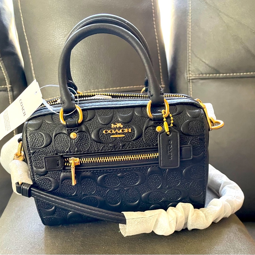 Never before worn brand new Coach bag black it’s a great value !